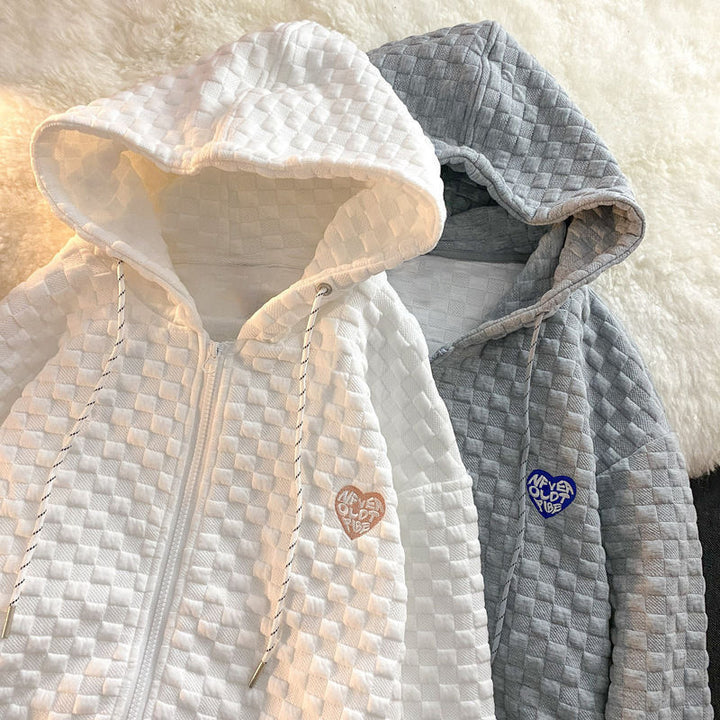 Damhoodiejacka gjord av strukturerat material med praktiska fickor och trendig design-Eva Jonsson