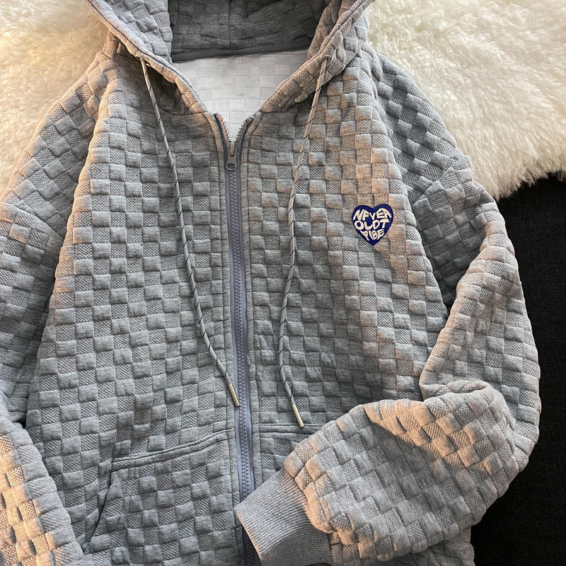 Damhoodiejacka gjord av strukturerat material med praktiska fickor och trendig design-Eva Jonsson