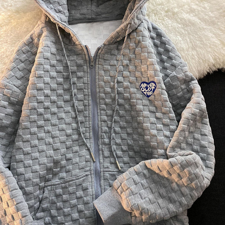 Damhoodiejacka gjord av strukturerat material med praktiska fickor och trendig design-Eva Jonsson