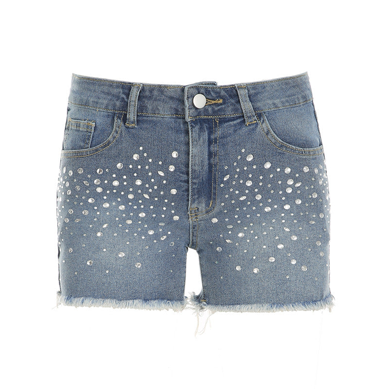 Damjeansshorts med glittrande applikationer och fransad fåll Mirla-Eva Jonsson