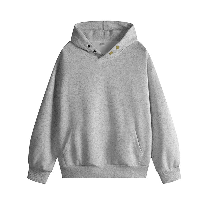 Damkappadpullover med innovativ skärning och praktiska tryckknappar Mirla-Eva Jonsson