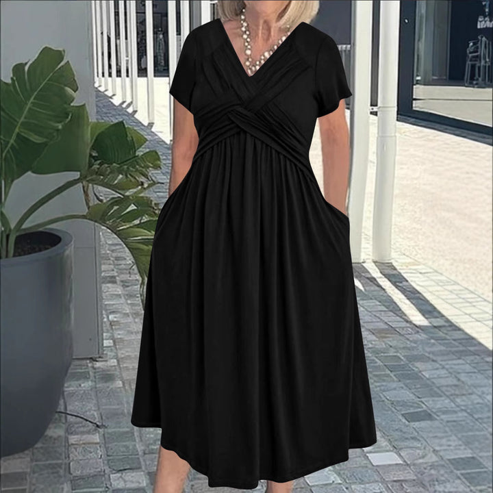 Damkjol med figursydd omslagdesign och elegant V-ringning Mirla-Eva Jonsson