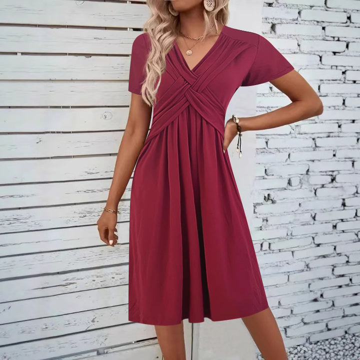 Damkjol med figursydd omslagdesign och elegant V-ringning Mirla-Eva Jonsson