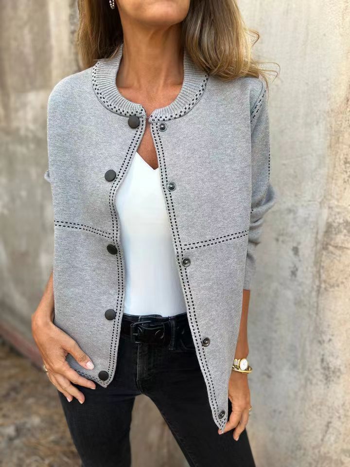 Damkjol med knappslå och elegante halslinje Mirla-Eva Jonsson