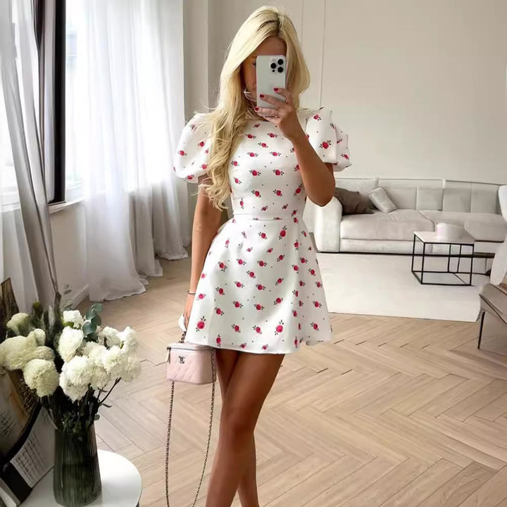 Damklänning med puffärmar och blommönster Mirla-Eva Jonsson