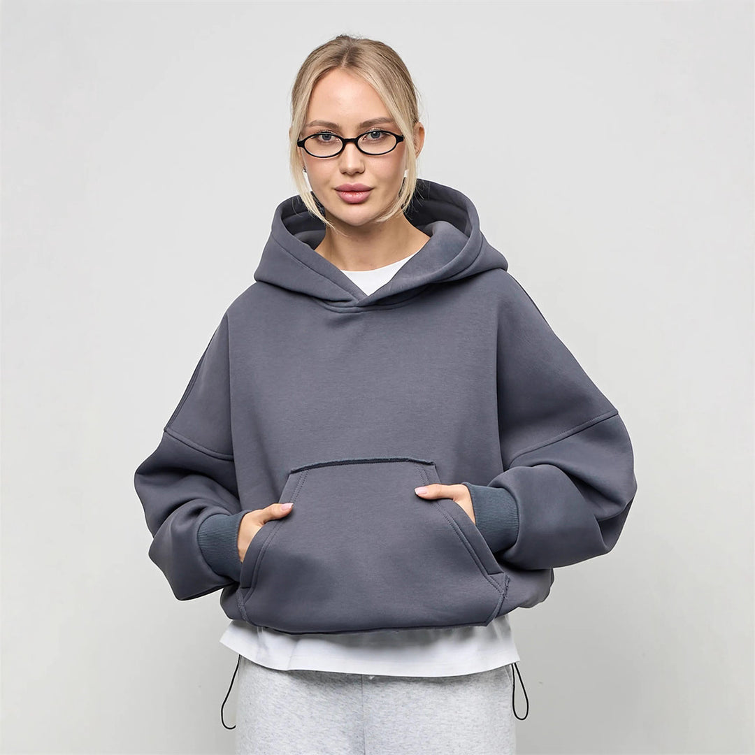 Dammens oversized huvtröja med sidofickor och avslappnad passform Mirla-Eva Jonsson