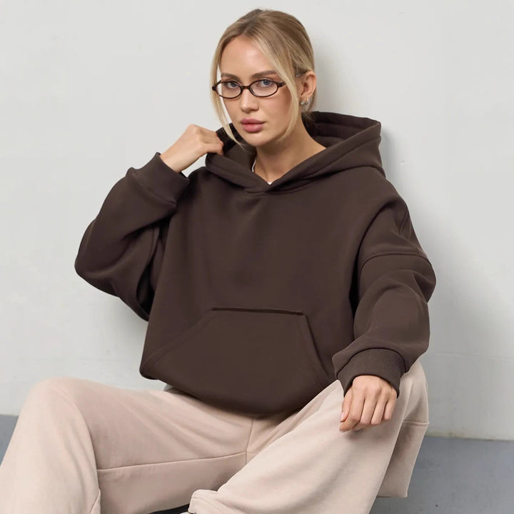 Dammens oversized huvtröja med sidofickor och avslappnad passform Mirla-Eva Jonsson