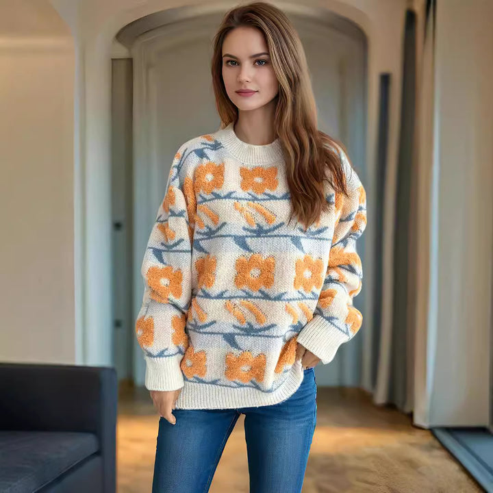 Dammens stickad tröja med blommönster och avslappnad passform Mirla-Eva Jonsson