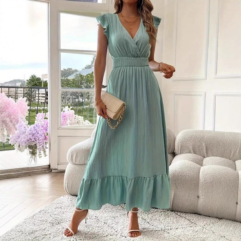Dams Maxiklänning med voluminösa volangärmar och elegant midja Mirla-Eva Jonsson