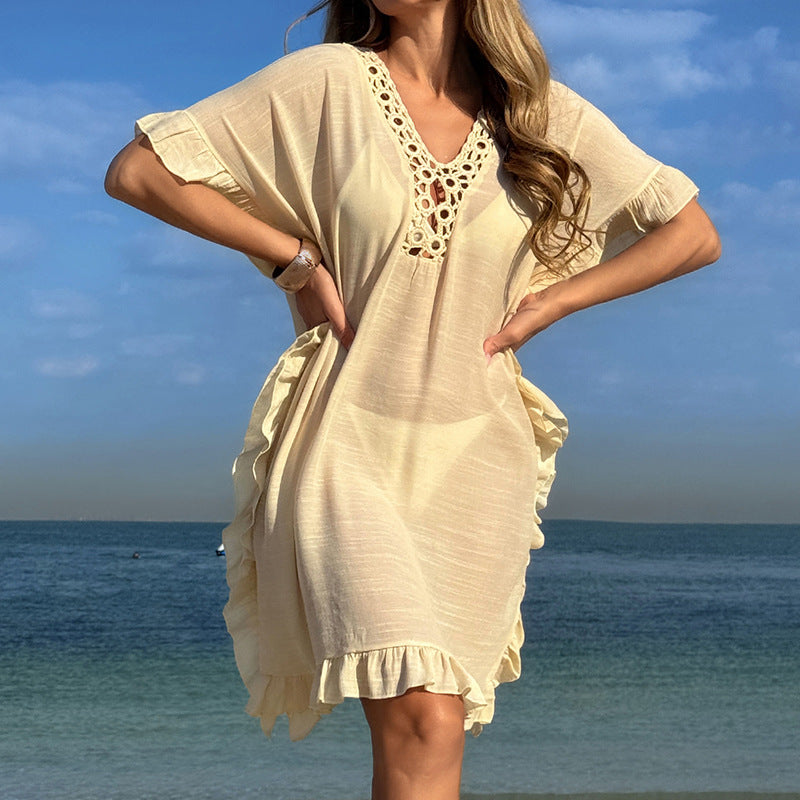 Dams Strandtunfika med elegant hakdetalj och volangdetaljer Mirla-Eva Jonsson