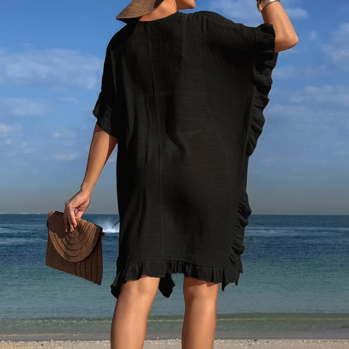 Dams Strandtunfika med elegant hakdetalj och volangdetaljer Mirla-Eva Jonsson