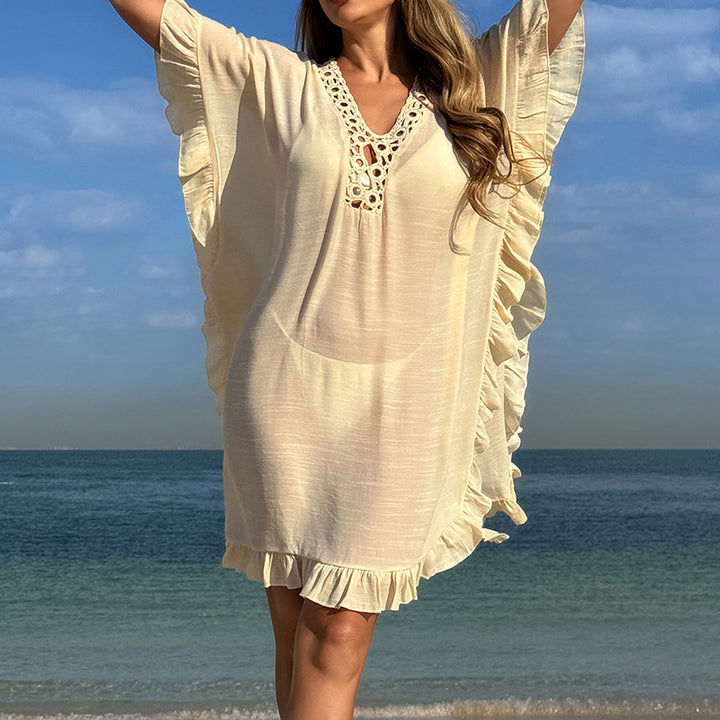 Dams Strandtunfika med elegant hakdetalj och volangdetaljer Mirla-Eva Jonsson