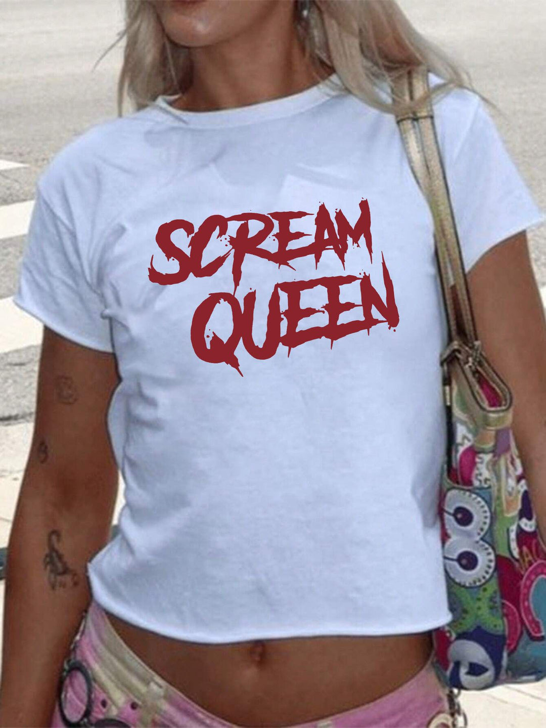 Dams T-shirt med glittrande diskokula-motiv och samtida slinga-detail Mirla-Eva Jonsson