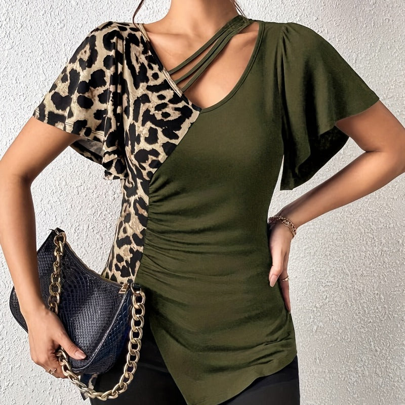 Dams Trendy topp med asymmetrisk design och sofistikerade cut-outs Mirla-Eva Jonsson