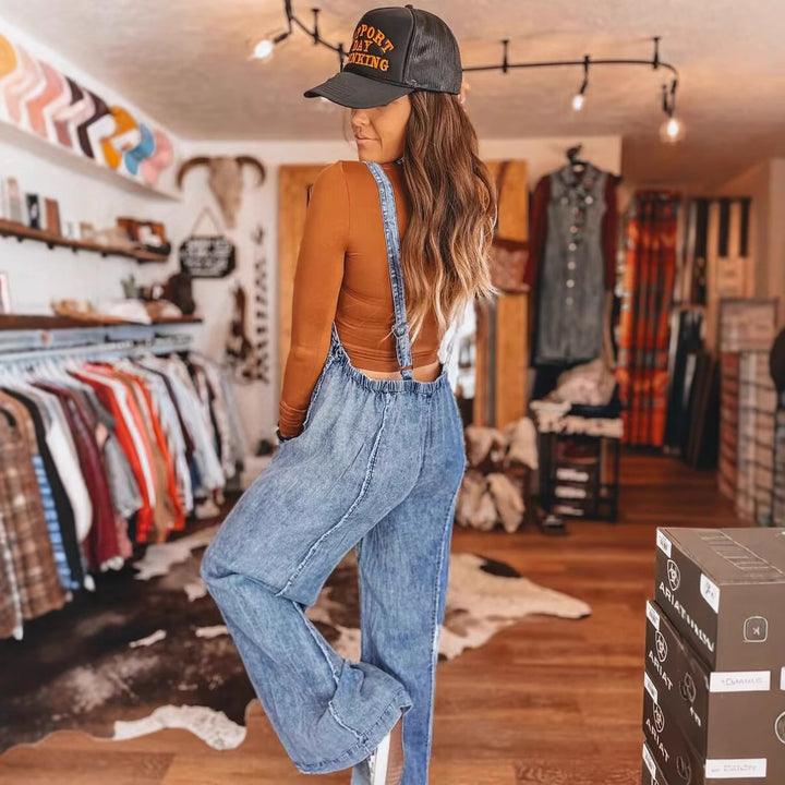 Dams denim hängselbyxor med vida ben och praktiska fickor Mirla-Eva Jonsson