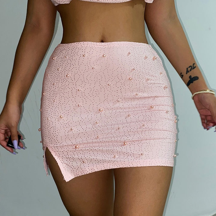 Dams elegant crop top med långa, genomskinliga ärmar och glittrande accenter Mirla-Eva Jonsson