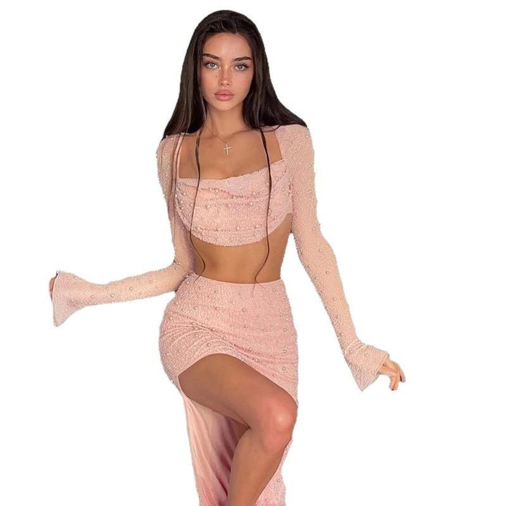 Dams elegant crop top med långa, genomskinliga ärmar och glittrande accenter Mirla-Eva Jonsson