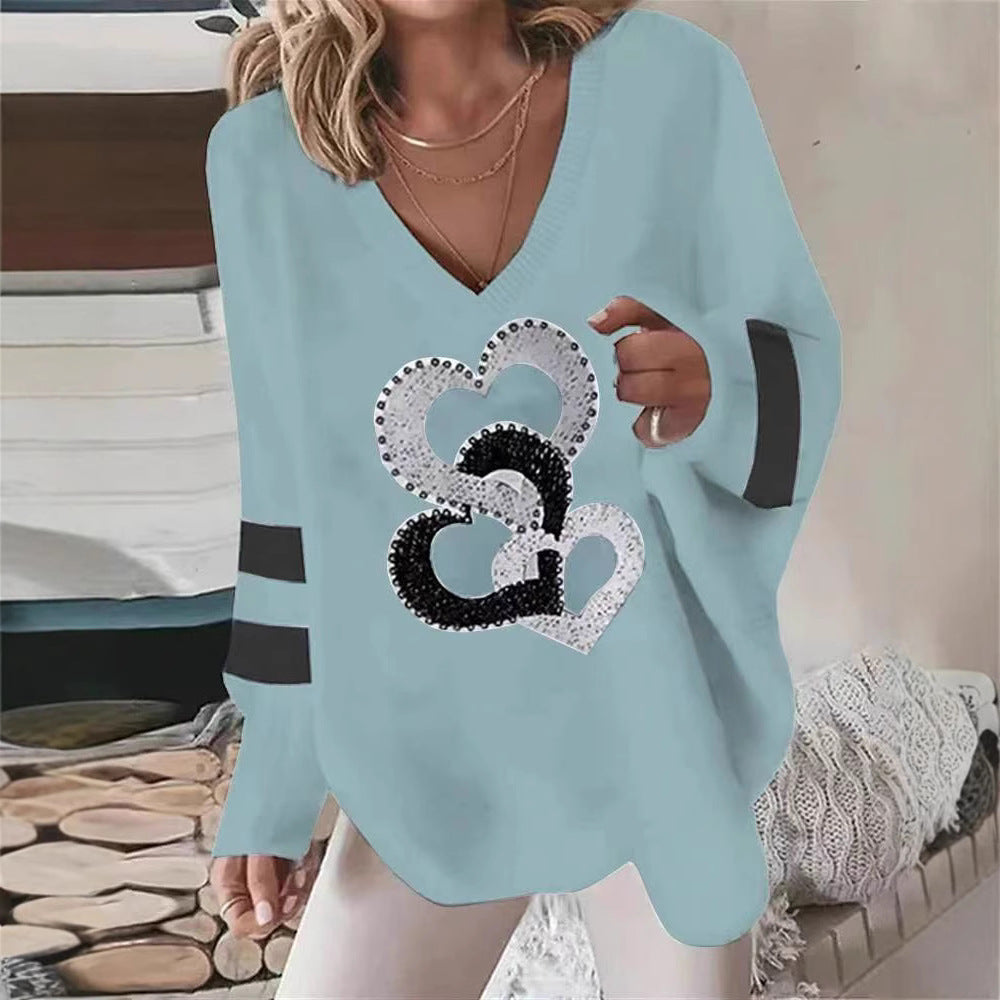 Dams hoodie med hjärtmotiv och eleganta kontraststräck Mirla-Eva Jonsson