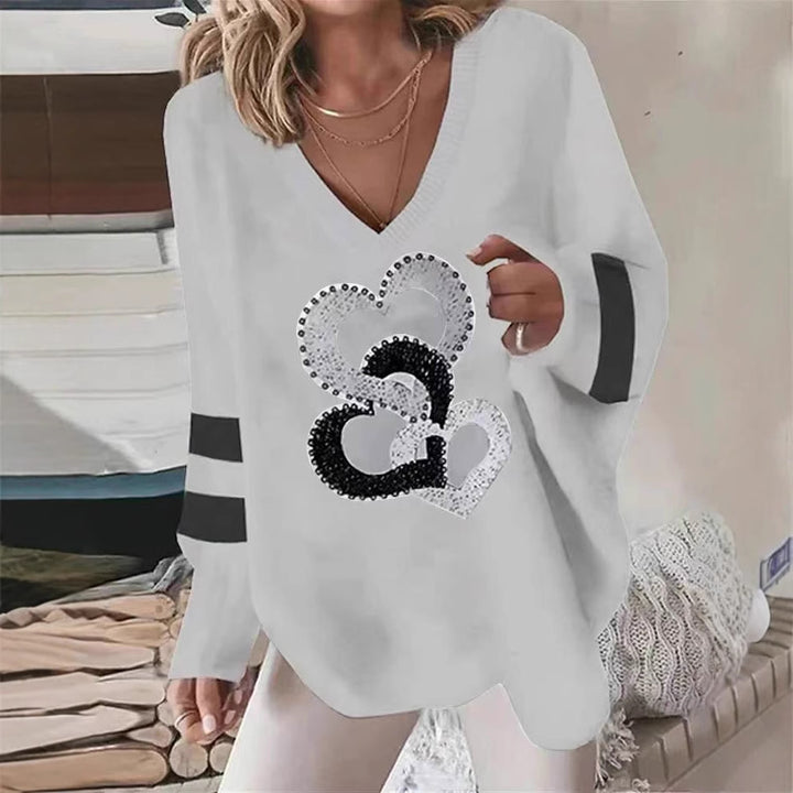 Dams hoodie med hjärtmotiv och eleganta kontraststräck Mirla-Eva Jonsson