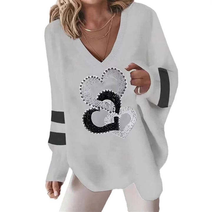 Dams hoodie med hjärtmotiv och eleganta kontraststräck Mirla-Eva Jonsson
