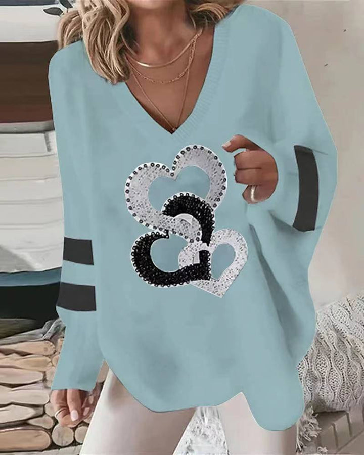 Dams hoodie med hjärtmotiv och eleganta kontraststräck Mirla-Eva Jonsson
