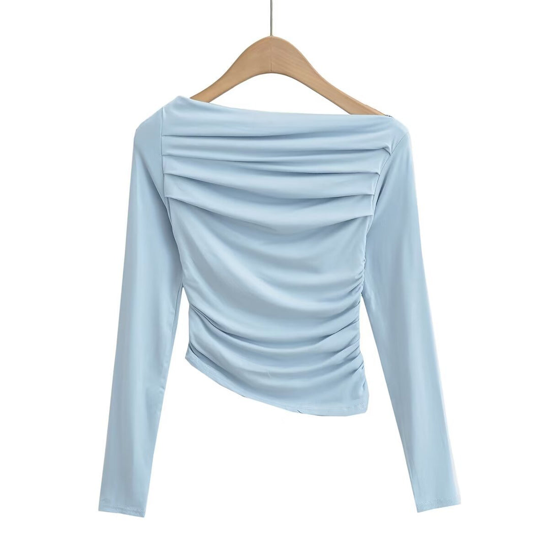 Dams långärmad topp med rynkat design och asymmetrisk halsringning Mirla-Eva Jonsson