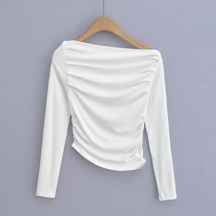 Dams långärmad topp med rynkat design och asymmetrisk halsringning Mirla-Eva Jonsson