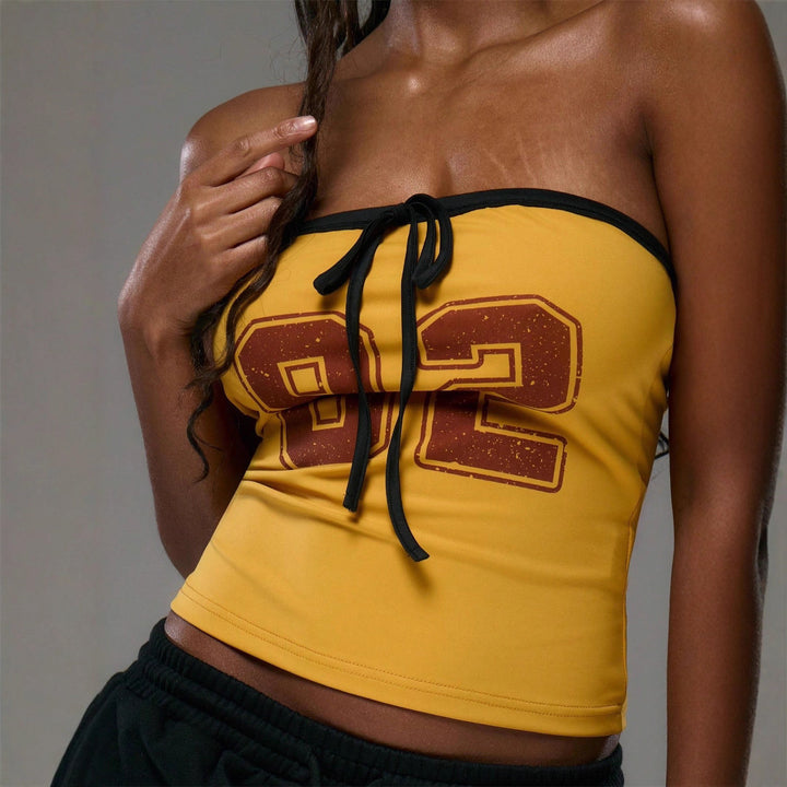 Dams topp med strapless design och dekorativ dragsko Eva Jonsson-Eva Jonsson