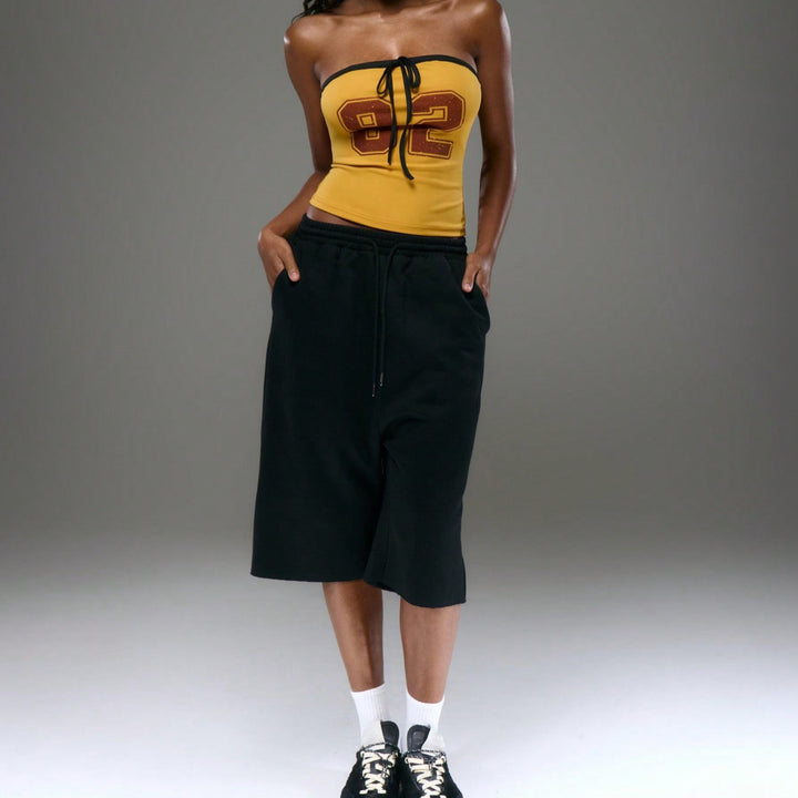 Dams topp med strapless design och dekorativ dragsko Eva Jonsson-Eva Jonsson