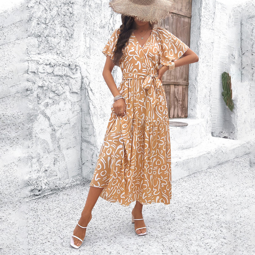 Dams wrap dress with voluminous sleeves and playful pattern Mirla-Eva Jonsson