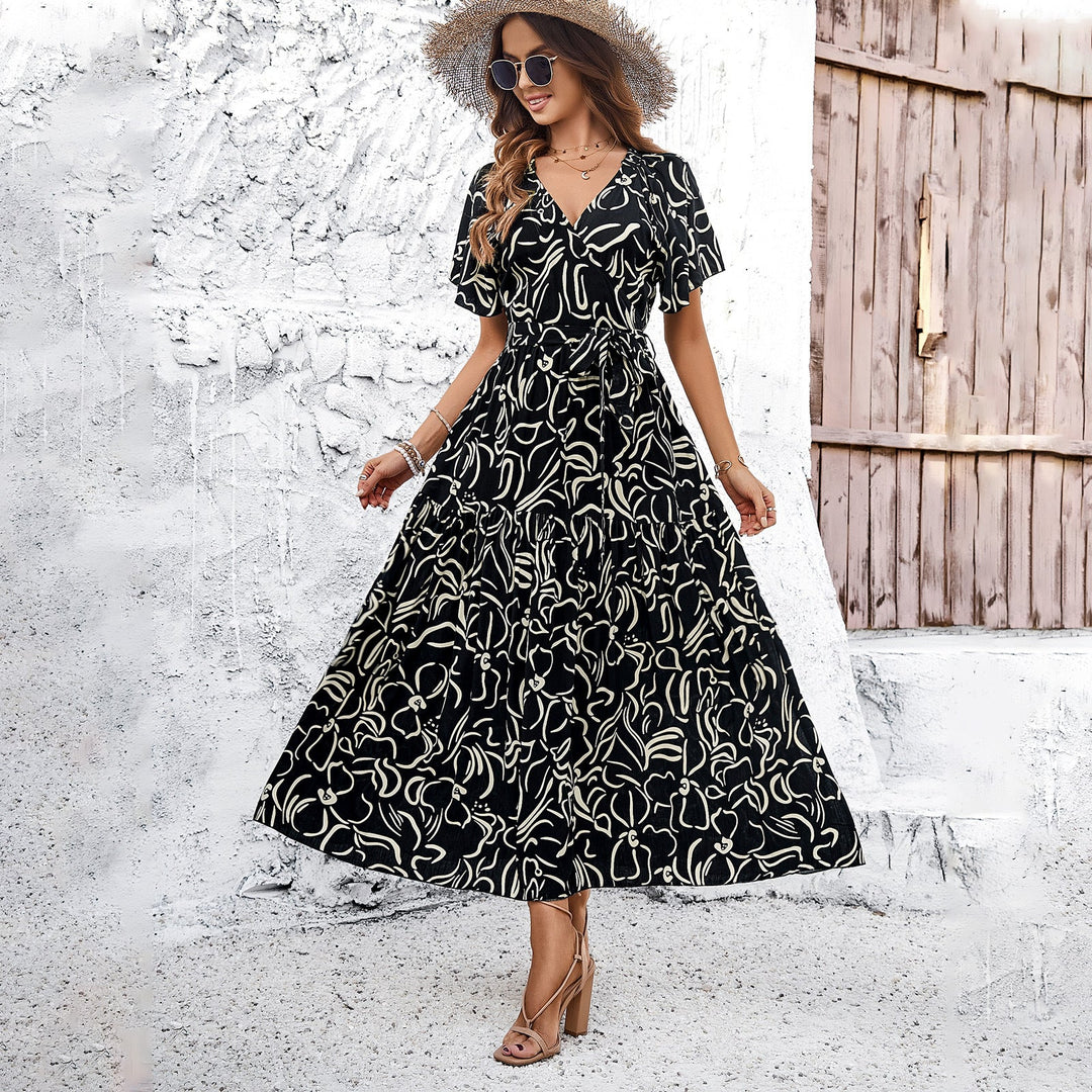 Dams wrap dress with voluminous sleeves and playful pattern Mirla-Eva Jonsson