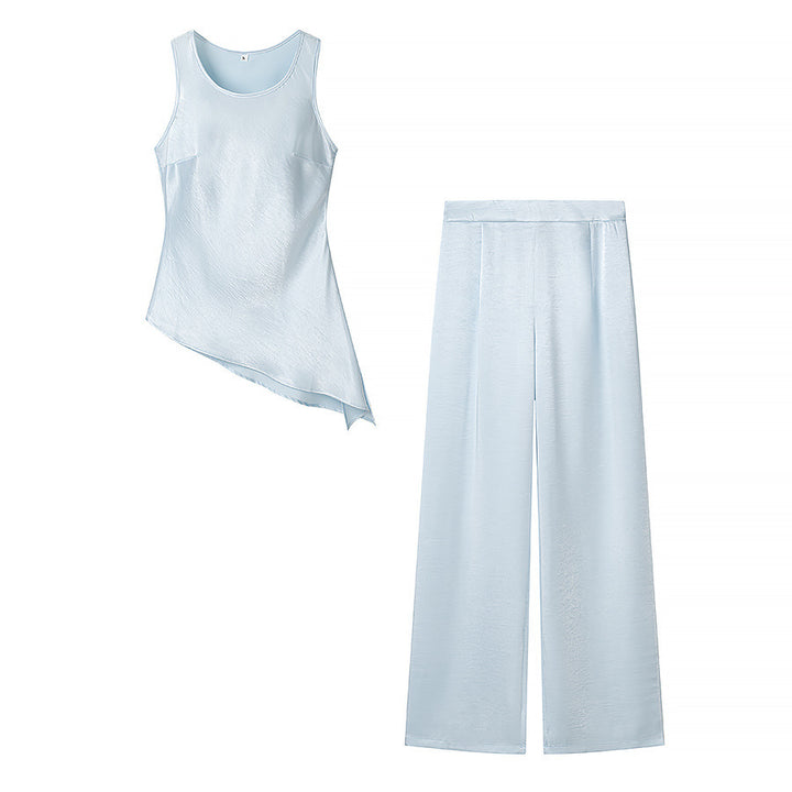 Damsätt bestående av elegant överdel med asymmetrisk fåll och vida byxor Mirla-Eva Jonsson