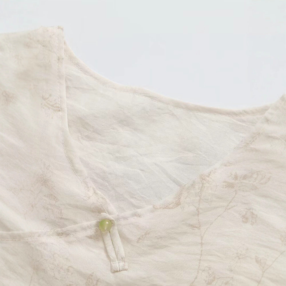Damsk Blusentop med blommönster och eleganta volangdetaljer Mirla-Eva Jonsson