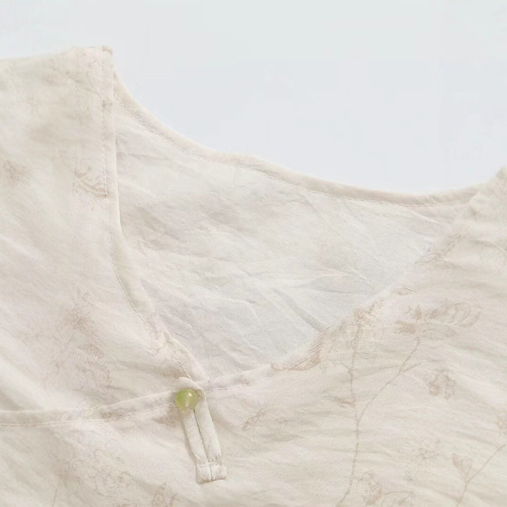 Damsk Blusentop med blommönster och eleganta volangdetaljer Mirla-Eva Jonsson