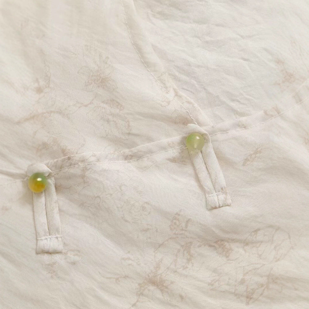 Damsk Blusentop med blommönster och eleganta volangdetaljer Mirla-Eva Jonsson