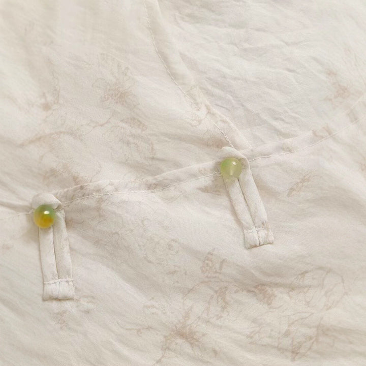 Damsk Blusentop med blommönster och eleganta volangdetaljer Mirla-Eva Jonsson