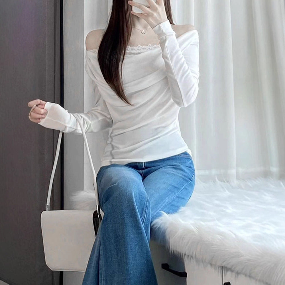Damsk långärmad blus med asymmetrisk utringning och elegant drapering Mirla-Eva Jonsson
