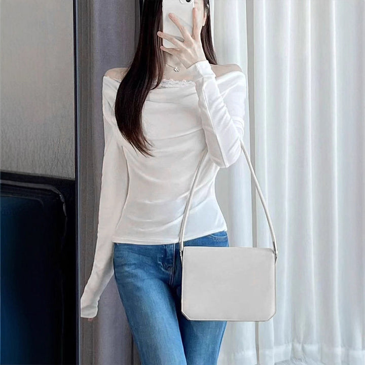 Damsk långärmad blus med asymmetrisk utringning och elegant drapering Mirla-Eva Jonsson