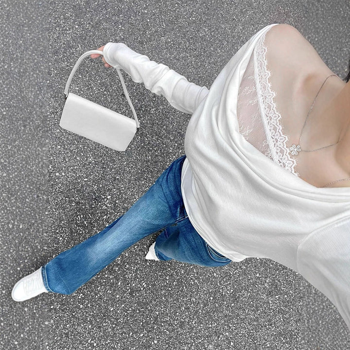 Damsk långärmad blus med asymmetrisk utringning och elegant drapering Mirla-Eva Jonsson
