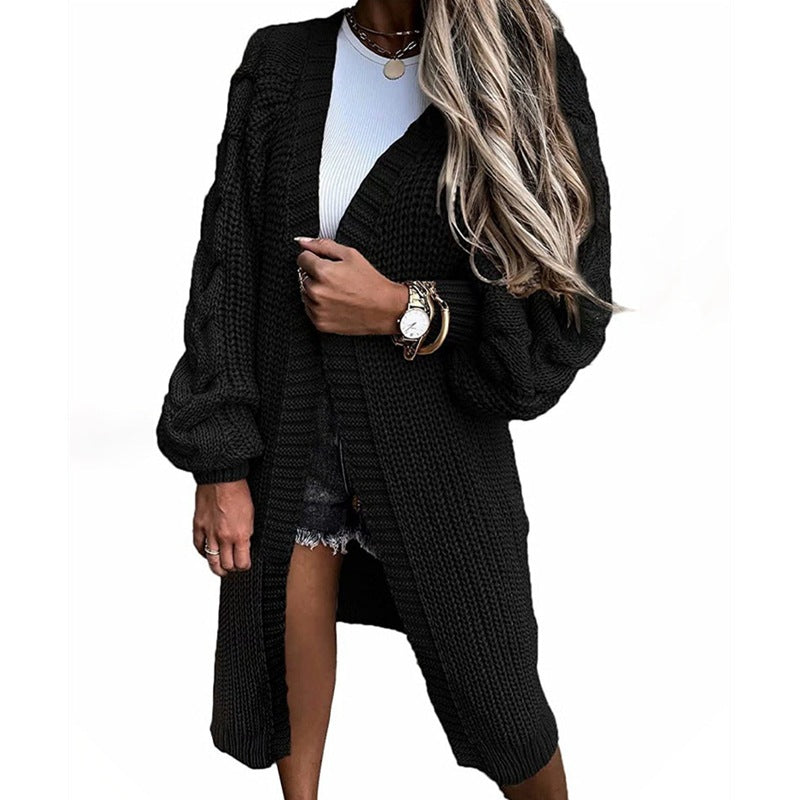 Damsk stickad jacka med voluminösa ärmar och högkvalitativt flätadesign Eva Jonsson-Eva Jonsson