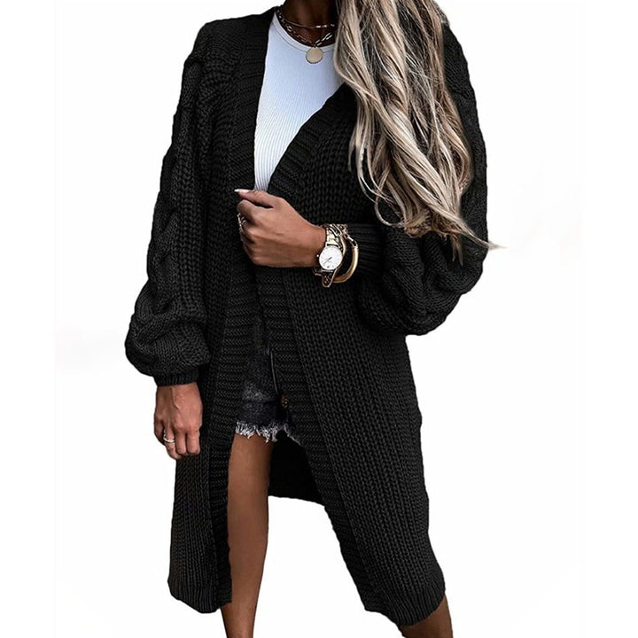 Damsk stickad jacka med voluminösa ärmar och högkvalitativt flätadesign Eva Jonsson-Eva Jonsson