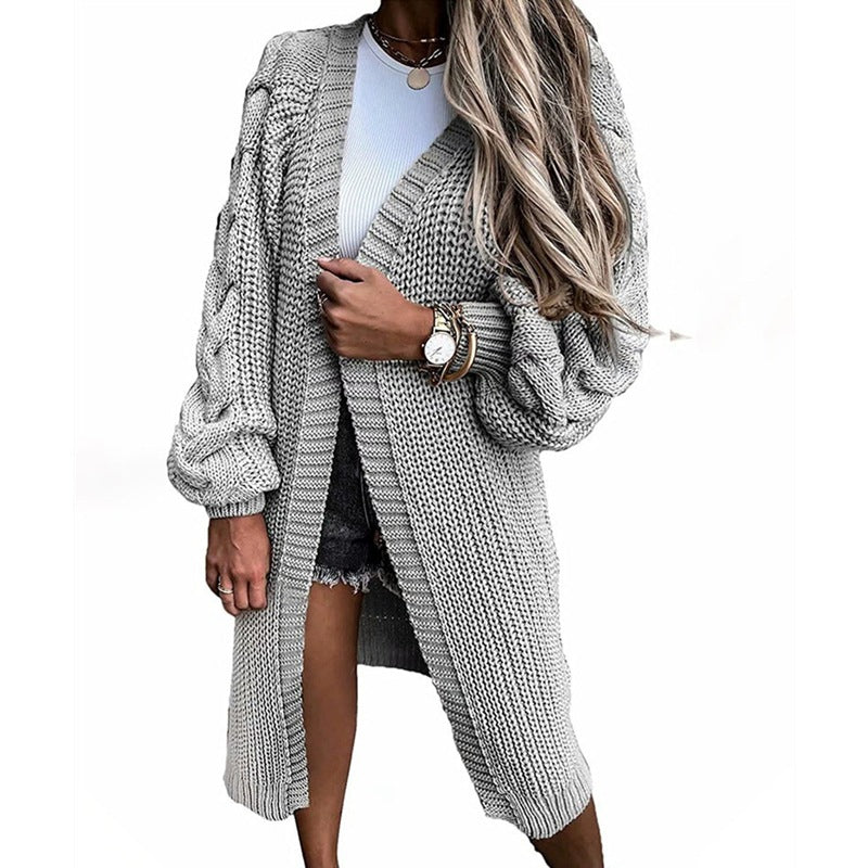 Damsk stickad jacka med voluminösa ärmar och högkvalitativt flätadesign Eva Jonsson-Eva Jonsson