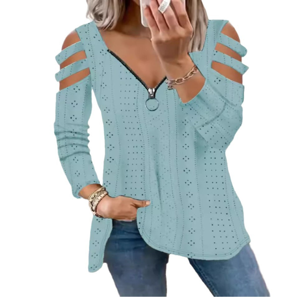 Damsk stickad topp med moderna cut-outs och dragkedja Mirla-Eva Jonsson