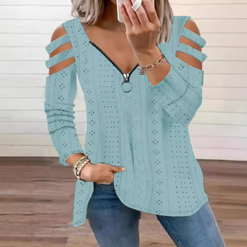 Damsk stickad topp med moderna cut-outs och dragkedja Mirla-Eva Jonsson