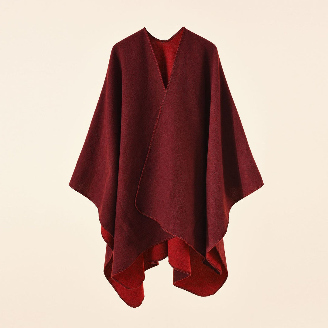 Damsk strickponcho med asymmetrisk skärning och hög värmehållningsfunktion Mirla-Eva Jonsson