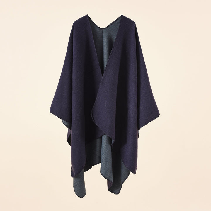 Damsk strickponcho med asymmetrisk skärning och hög värmehållningsfunktion Mirla-Eva Jonsson