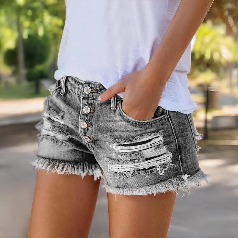 Damska jeansshorts med fransar och förstörda effekter Mirla-Eva Jonsson