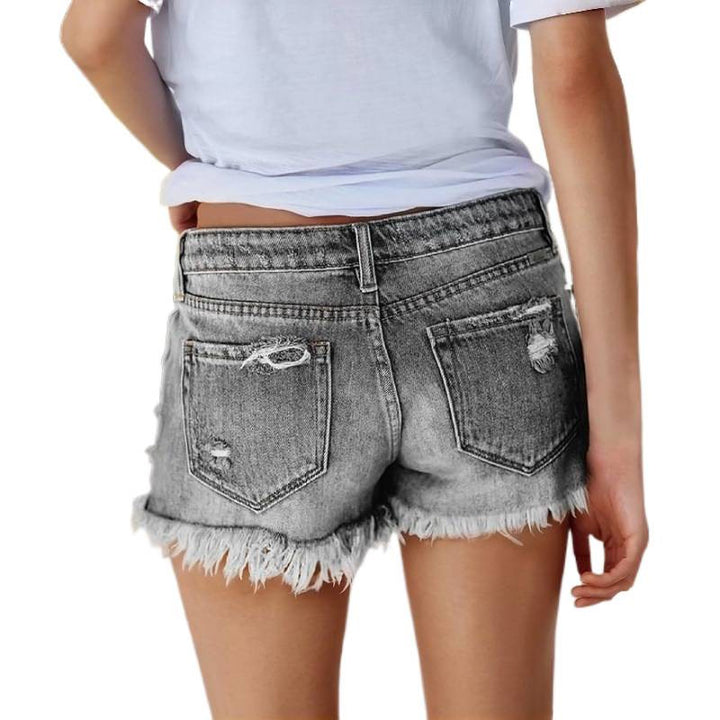 Damska jeansshorts med fransar och förstörda effekter Mirla-Eva Jonsson