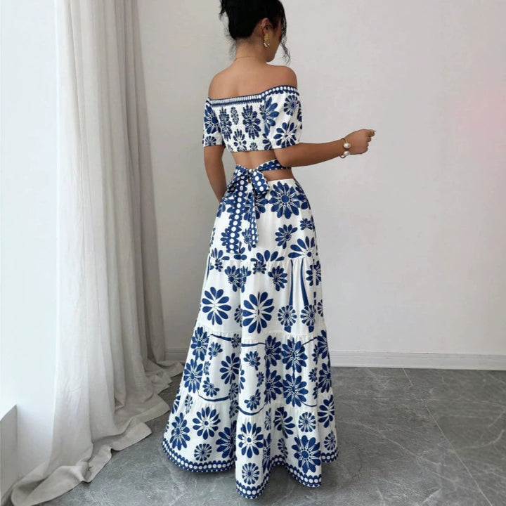 Damska maxiklänning med blommönster och trendig off-shoulder-cutout Mirla-Eva Jonsson