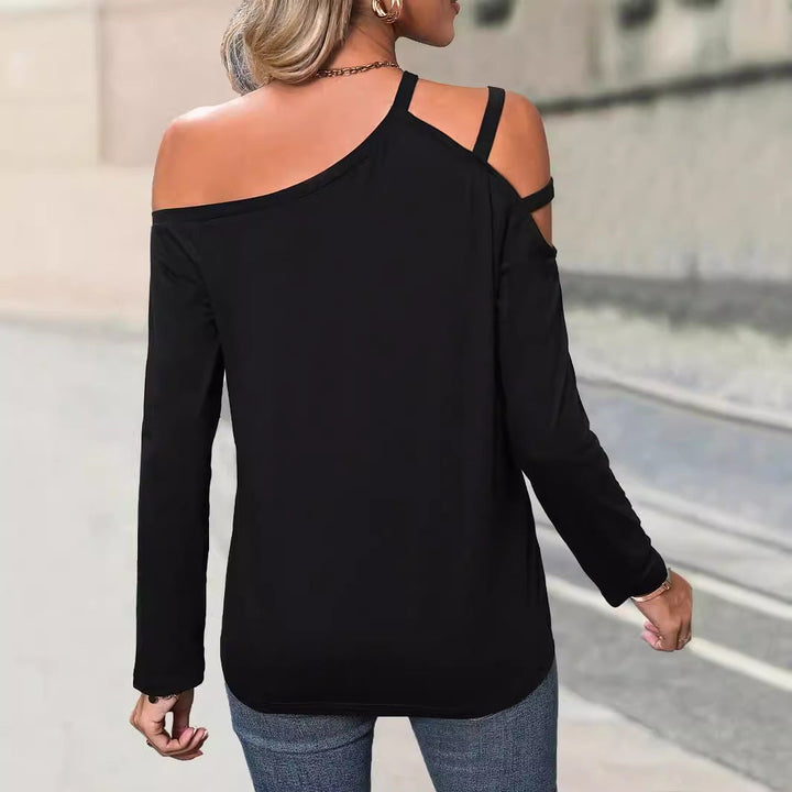 Damskicktop med asymmetrisk cut-out och trendiga bärdetaljer Mirla-Eva Jonsson